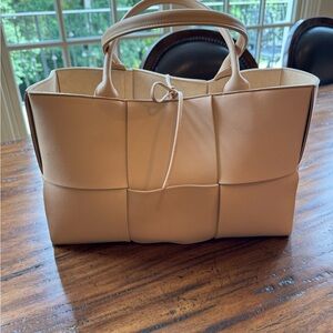 Bottega Venata Almond Arco Tote
Pristine - never carried 
Dust bag